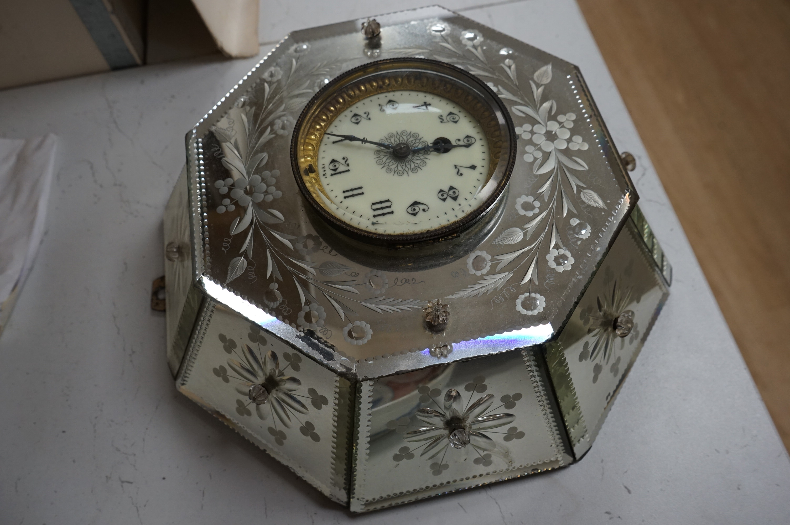 An early 20th century Venetian wheel engraved and mirrored glass octagonal wall clock, 30cm. Condition - fair to good, not tested